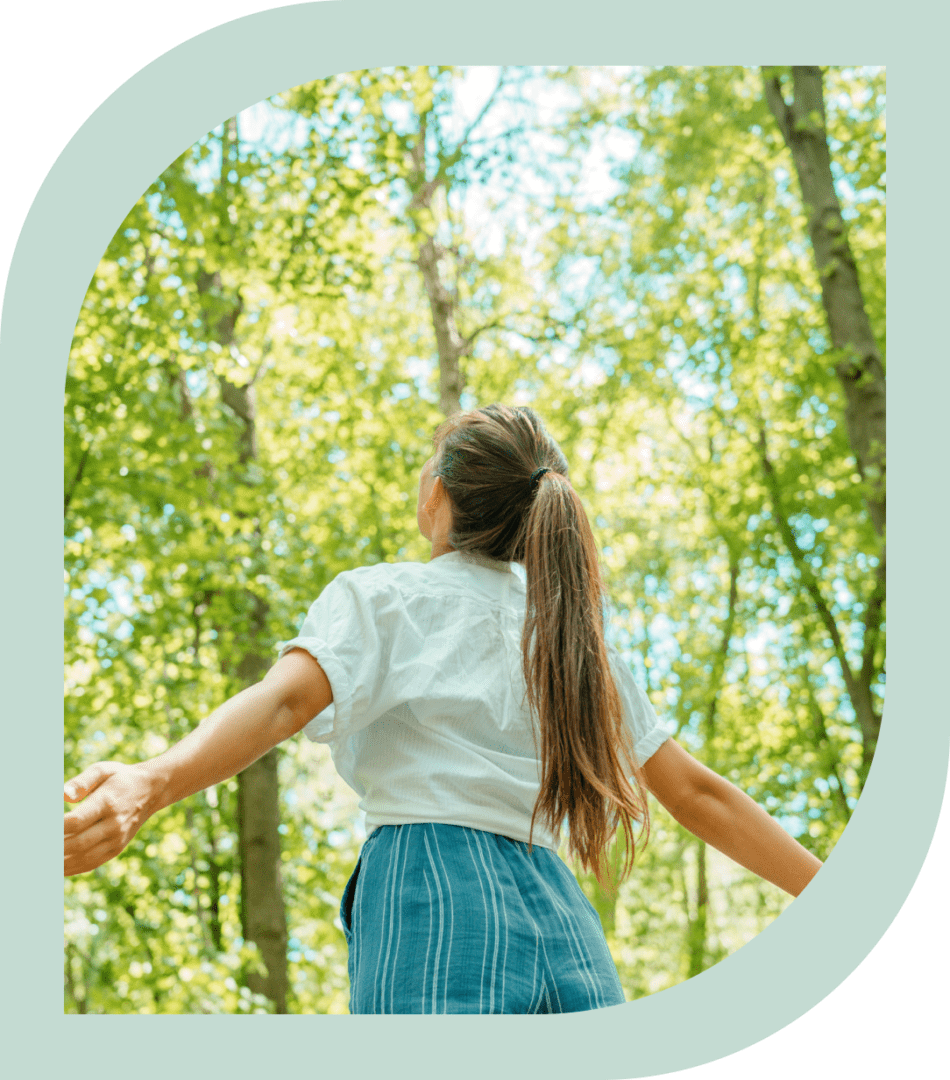 Woman enjoying nature in the forest.