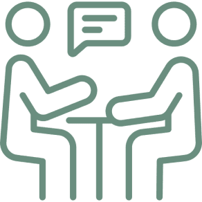 A green square with two people sitting at a table